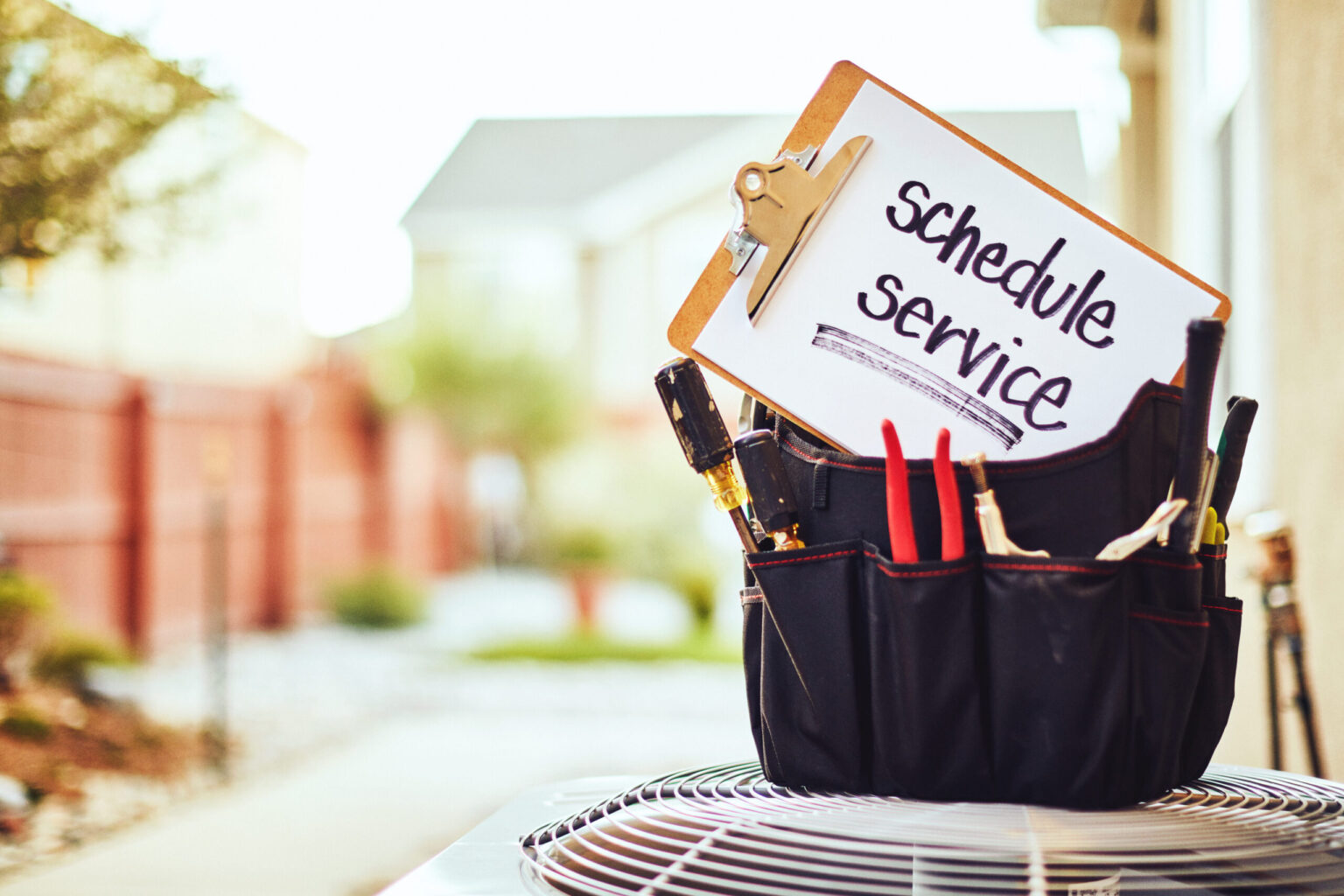 Air conditioner with maintenance tools and service reminder in residential back yard Chicago air conditioning repair HVAC